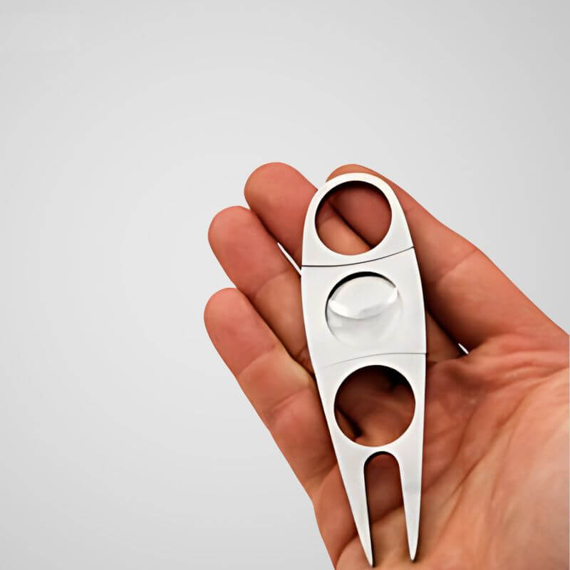 Cigar cutter divot repair tool
