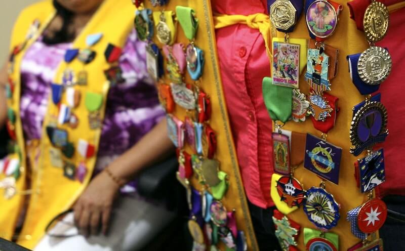 Pin Fiesta Medal at an Angle on Your Sash